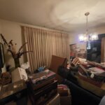 Living room full of belongings in an inherited house in Springfield, Ohio, sold as-is for cash
