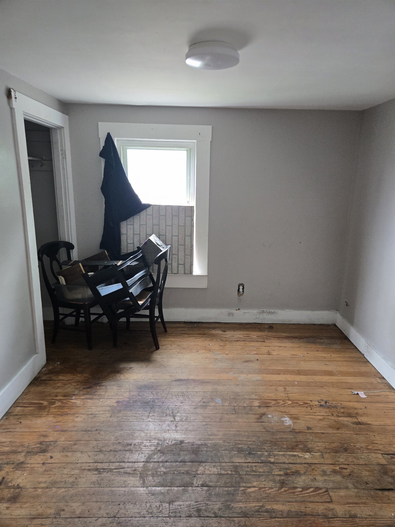 Bedroom and wood flooring at 23 North Douglas Avenue before renovation
