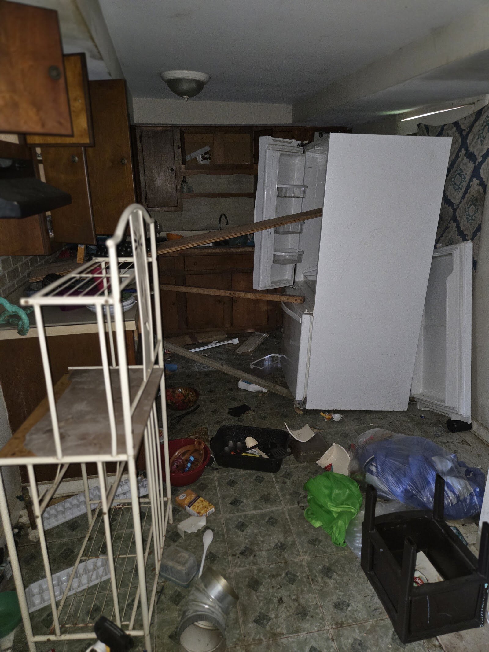 Kitchen cabinets and flooring at 23 North Douglas Avenue before renovation