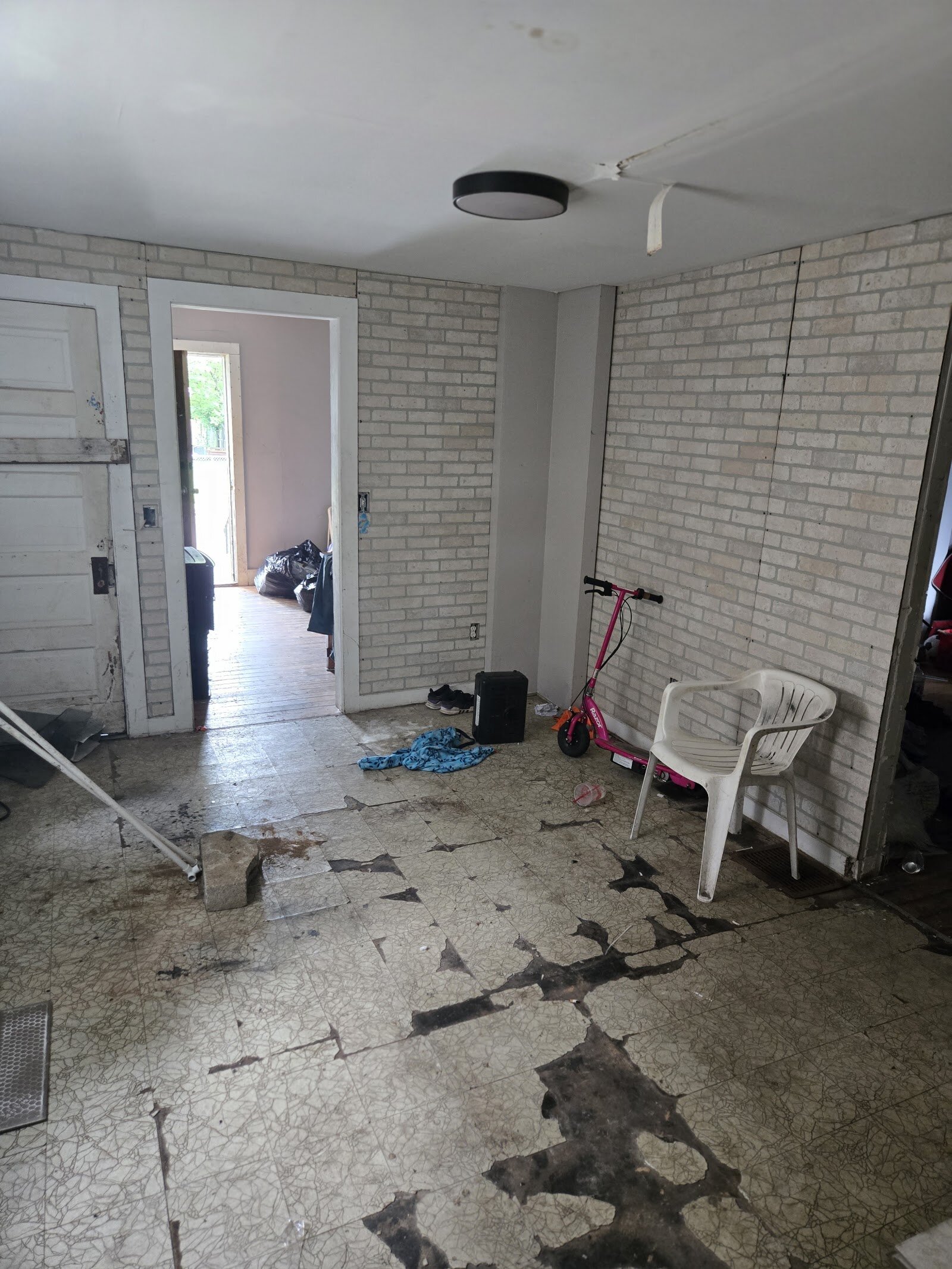 Dining room and worn flooring at 23 North Douglas Avenue before renovation