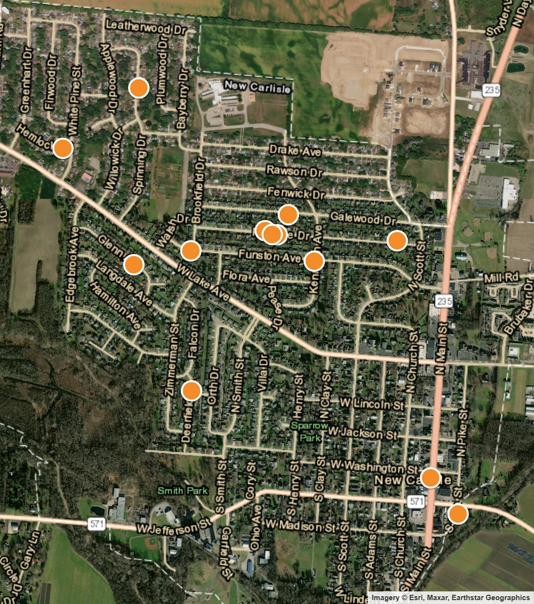 Satellite map of New Carlisle Ohio with orange dots marking houses bought by Comfort Living Buys Houses