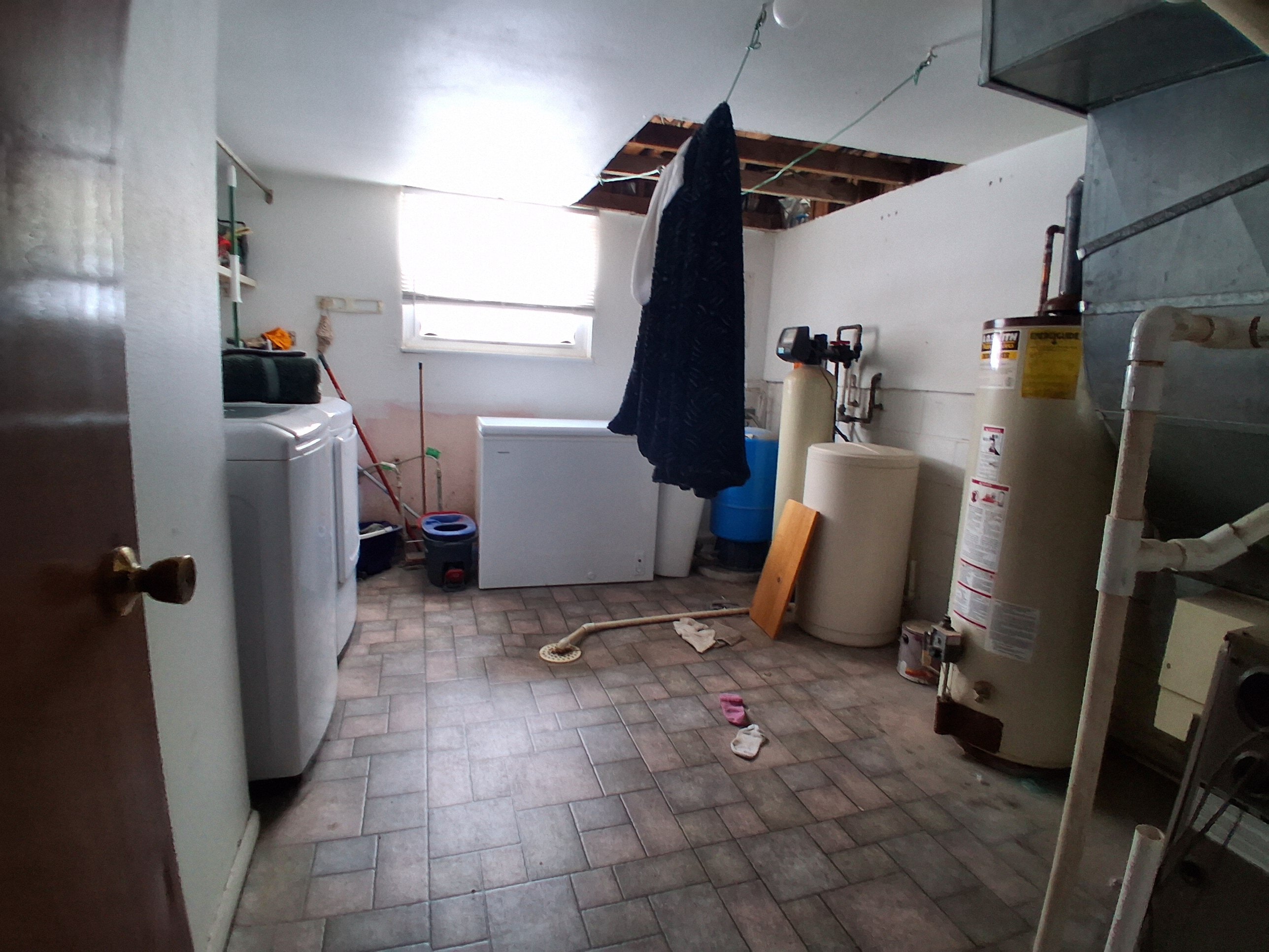 Laundry and utility room at 1922 Old Coach Road before renovation