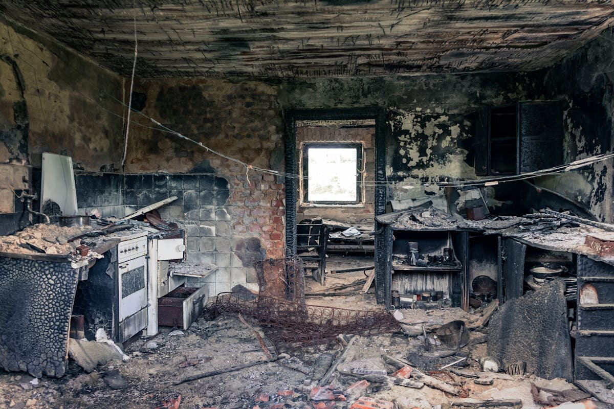 a burned room in a fire-damaged house