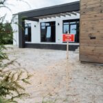 a house with a for sale sign outside