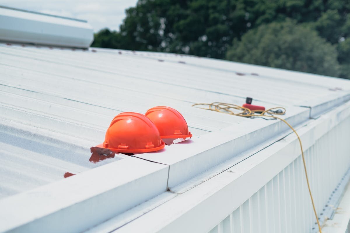 a couple hard hats on a roof