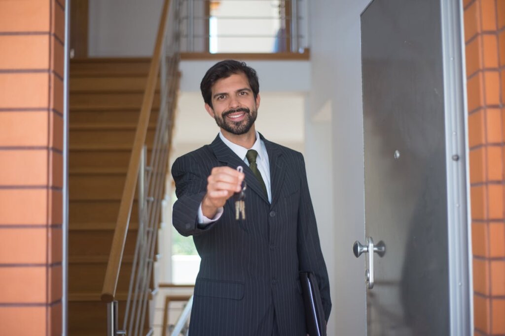 a man giving a key to a buyer