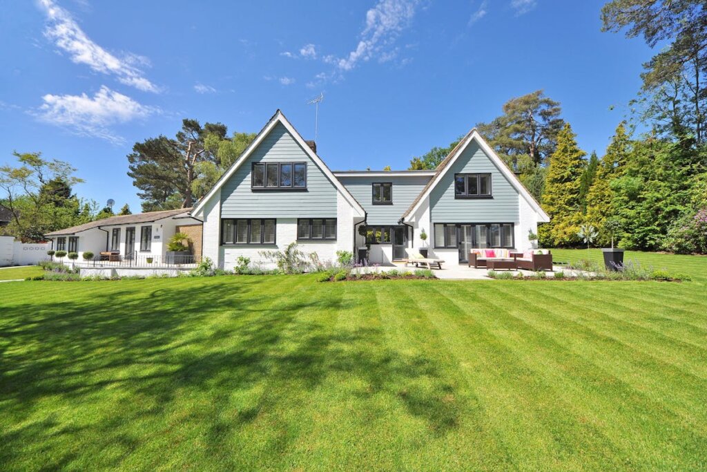A large yard with a big house on the property