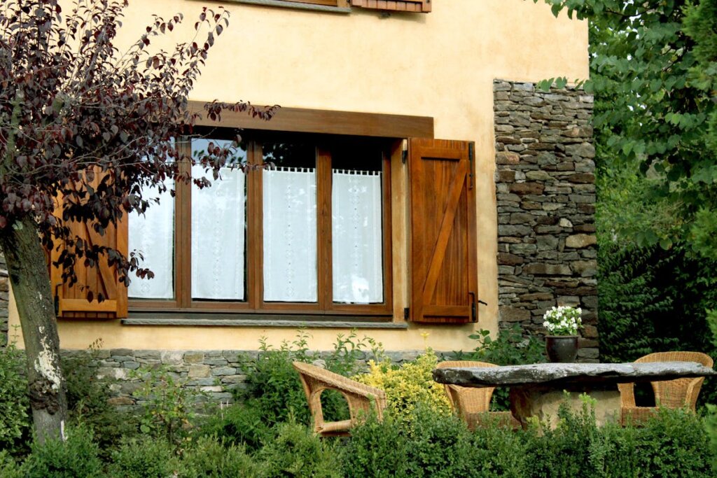 An old-fashion house with a stone table