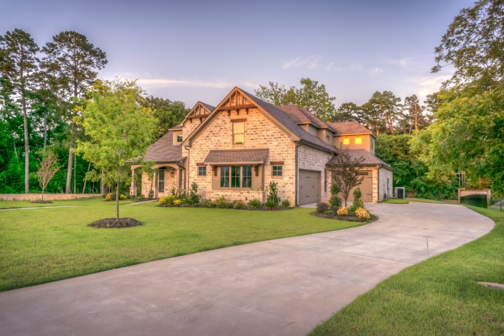 A brick house with a long driveway
