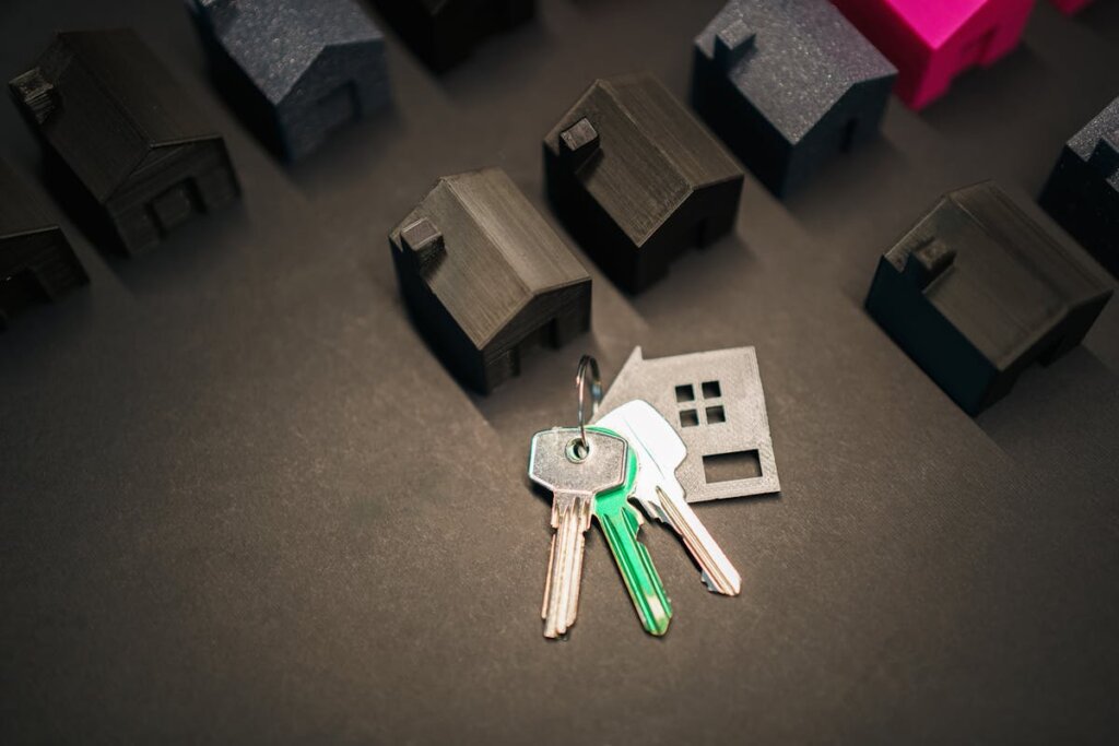 A bunch of keys next to a lineup of small houses