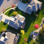 An above view of some houses in a suburban neighborhood