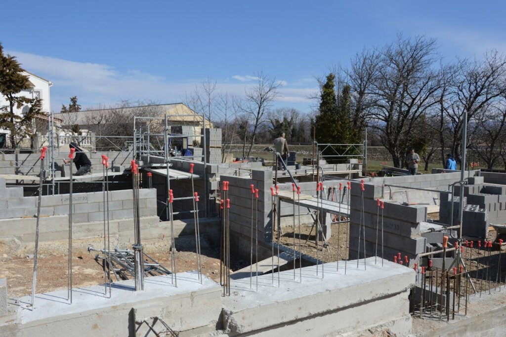 A foundation of a house being placed down