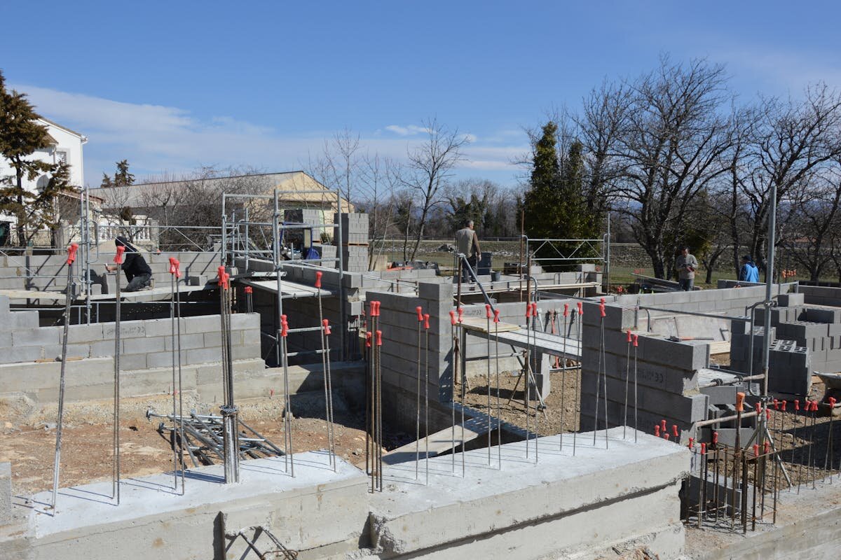 A foundation of a house being placed down