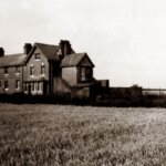A haunted farm house in a massive field