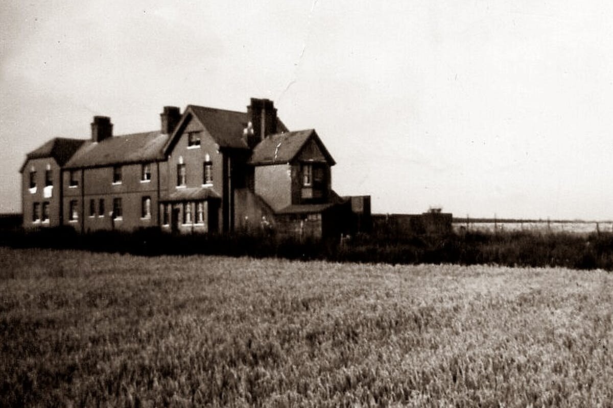 A haunted farm house in a massive field