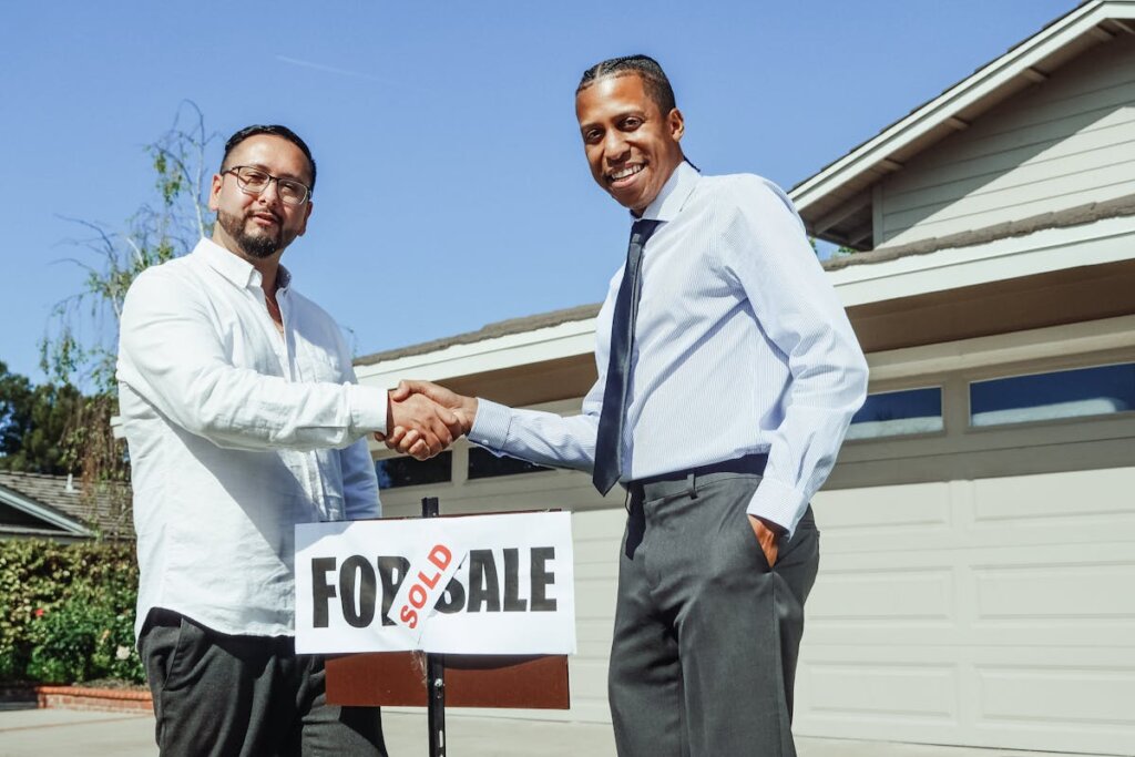 People shaking hands after a successful home sale