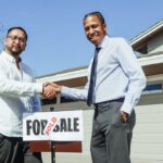 People shaking hands after a successful home sale