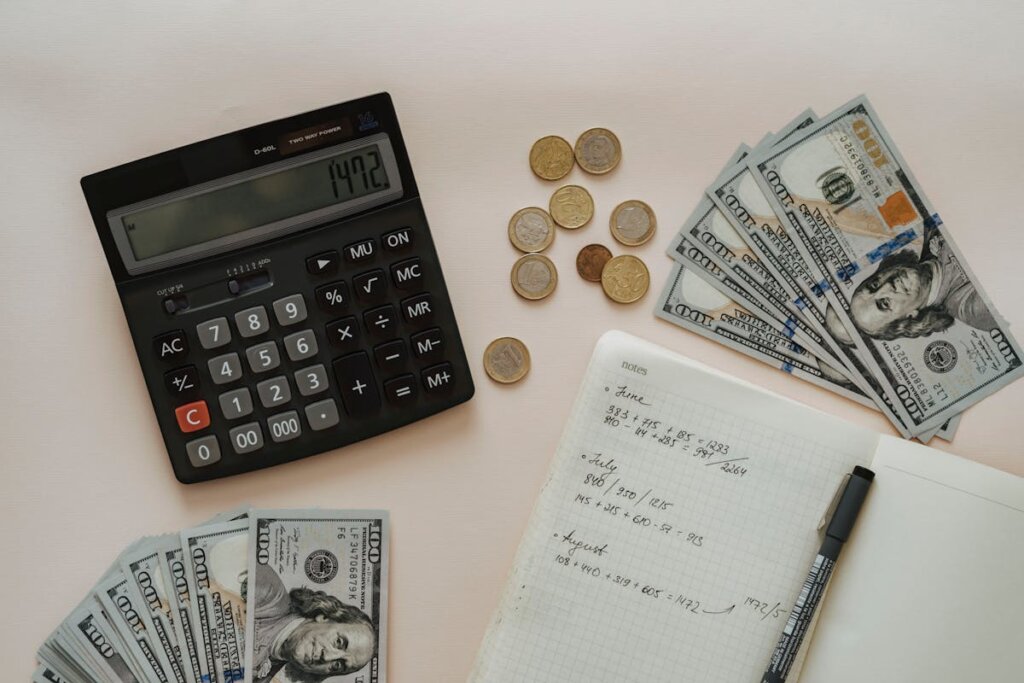 A bunch of cash sitting around a calculator