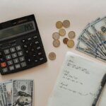 A bunch of cash sitting around a calculator