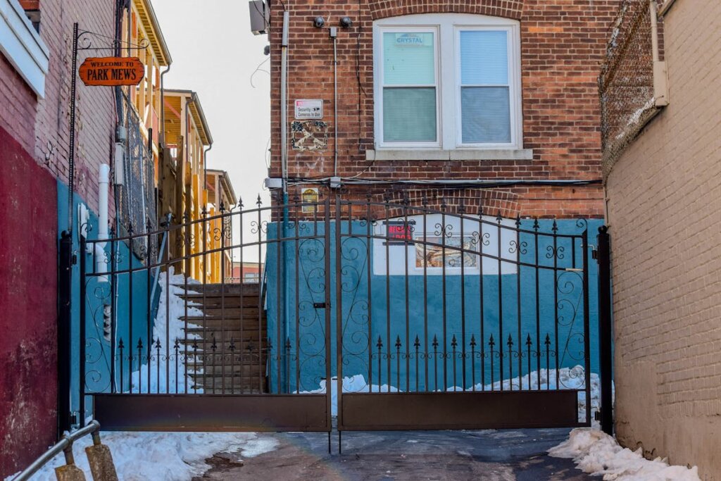 A gate blocking the pathway of an alley way