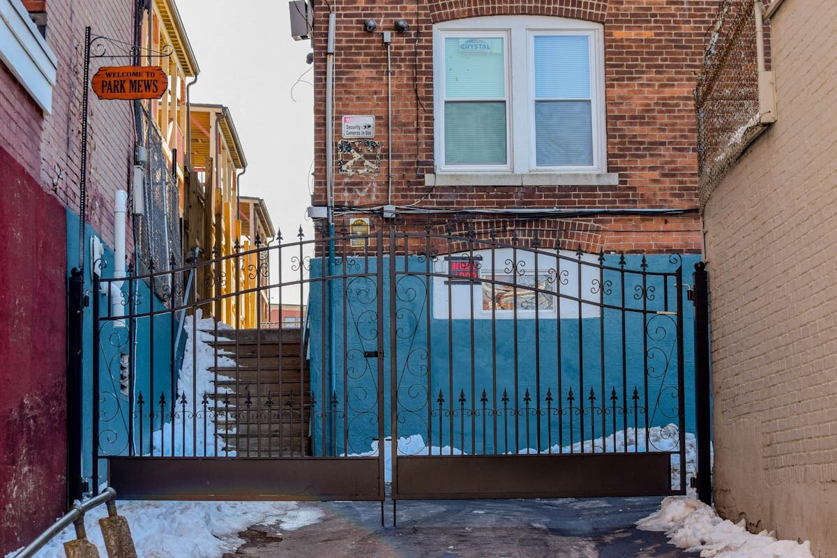 A gate blocking off a section of alleyway