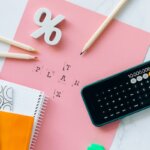 A bunch of tax papers with a calculator