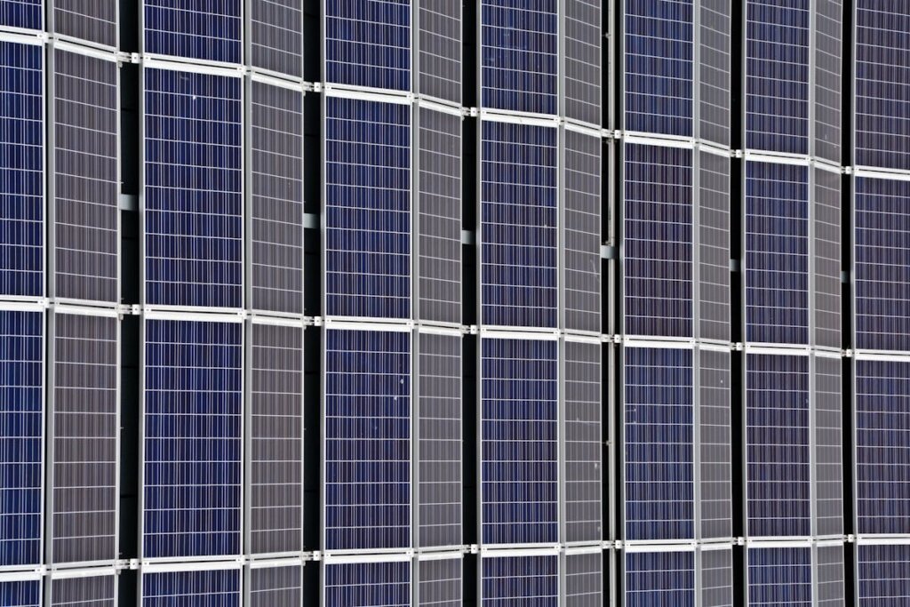 A bunch of solar panels all lined up perfectly