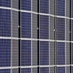 A bunch of solar panels all lined up perfectly