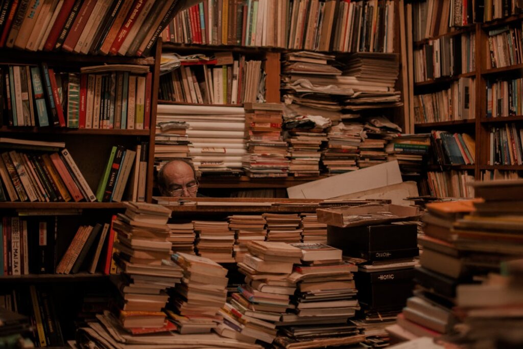 A hoarder in his room full of books