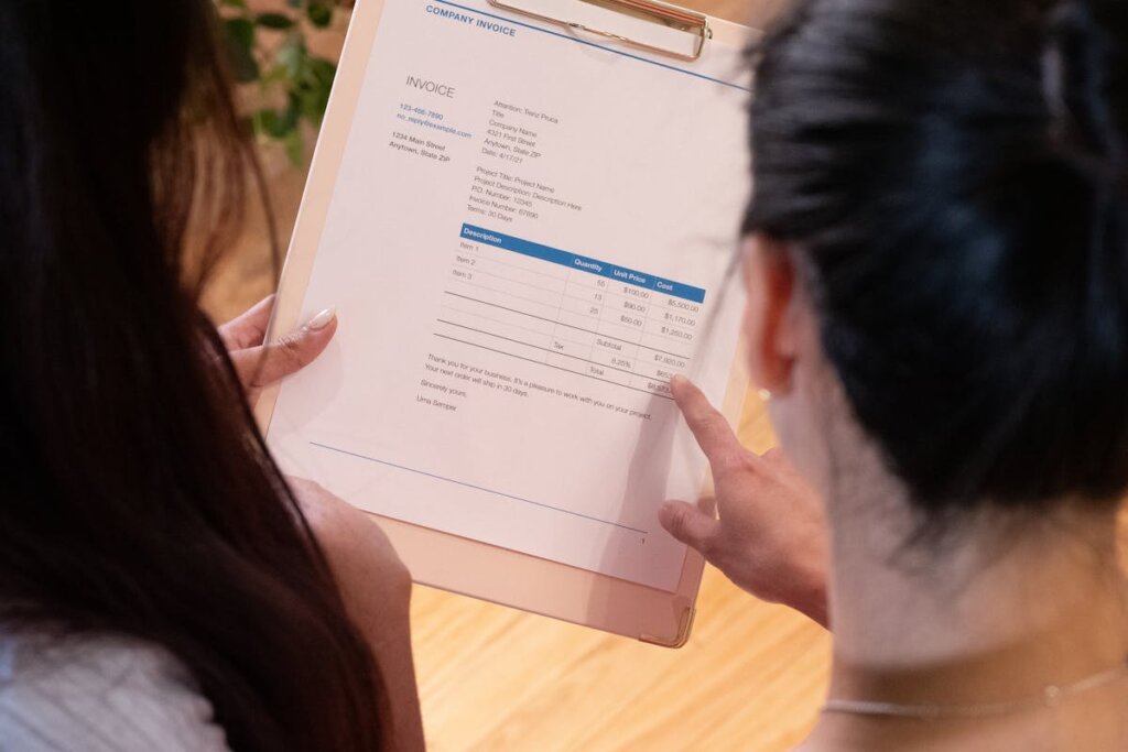 People looking at some papers with tax information on it