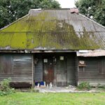 A very ugly house with moss on the roof