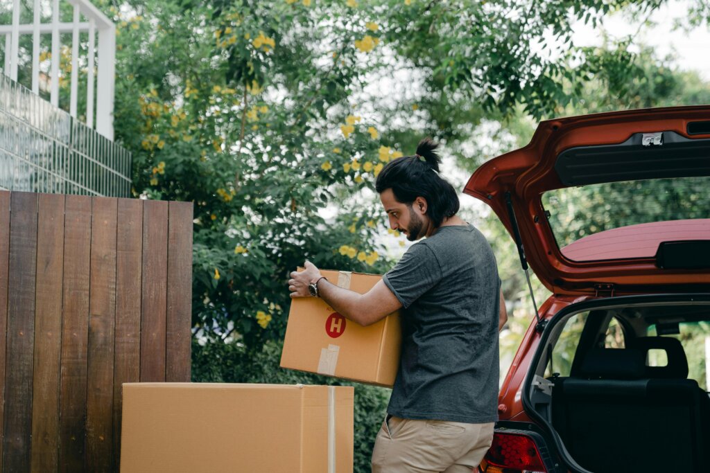 Man taking out boxes from his car
