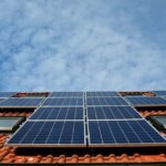 Solar panels on a roof against a blue sky in Dayton, Ohio.