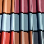 A close up of a roof with many different colored shingles.