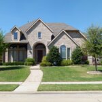 A home in the suburbs of Texas with a large yard, ready for summers.