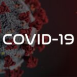 The impact of the Covid-19 pandemic on the roofing industry depicted through the word Covid-19 on a red background.