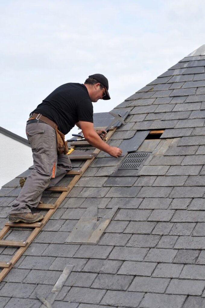 fixing a leaky shingle on the roof