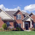 A ~~brick~~ home with a green lawn.