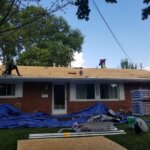 The house is getting a new roof installed due to punctures.