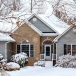 A winter home with snow on the ground.