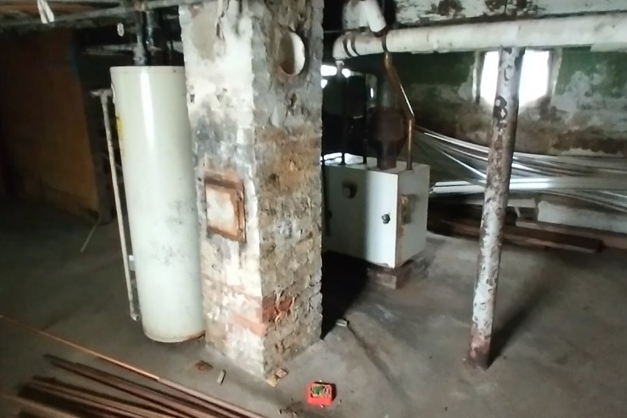Aging boiler in basement of pre-1960 Buffalo NY rental — the constant maintenance burden of Erie County's older housing stock