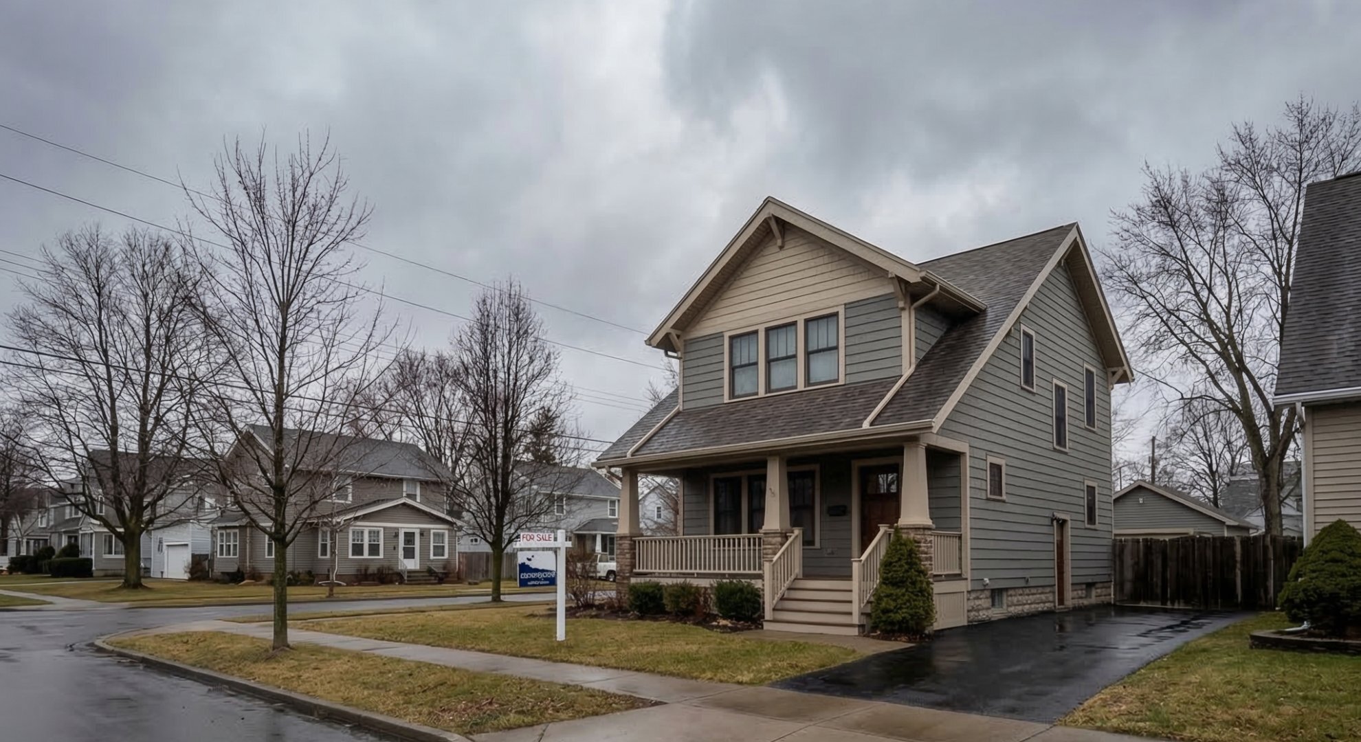 Buffalo NY home with For Sale sign on rainy day — divorce house sale