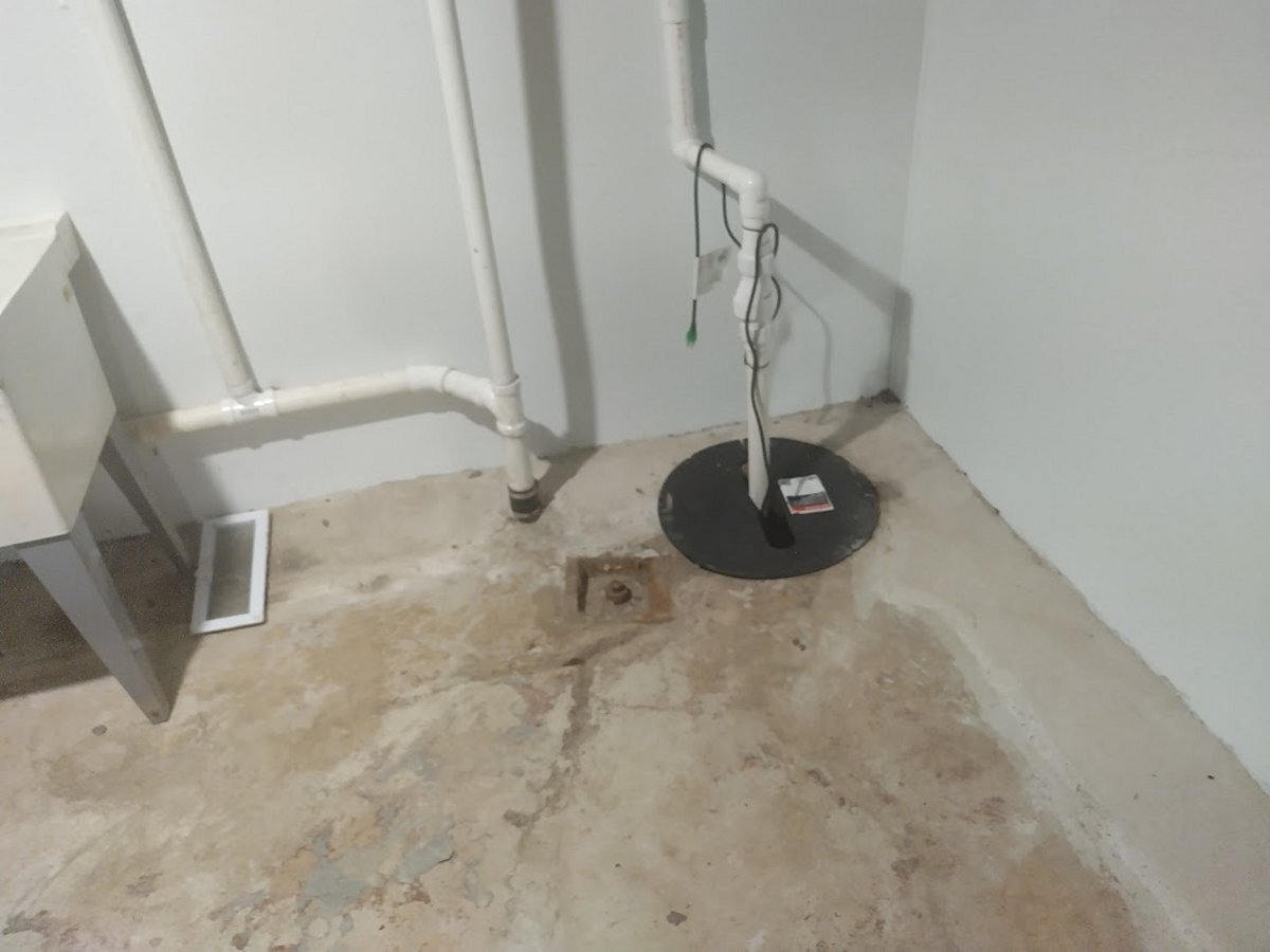 Interior French drain perimeter system and sump pump installation in Buffalo NY basement — standard WNY waterproofing repair