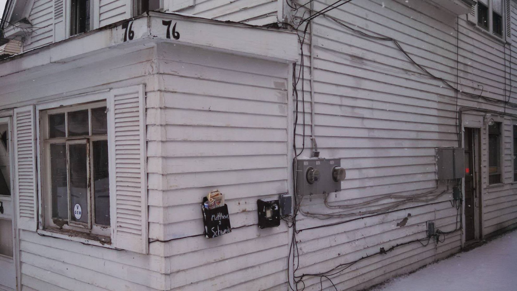 Two weathered mailboxes on Buffalo NY rental property — tired landlord sell rental cash buyer