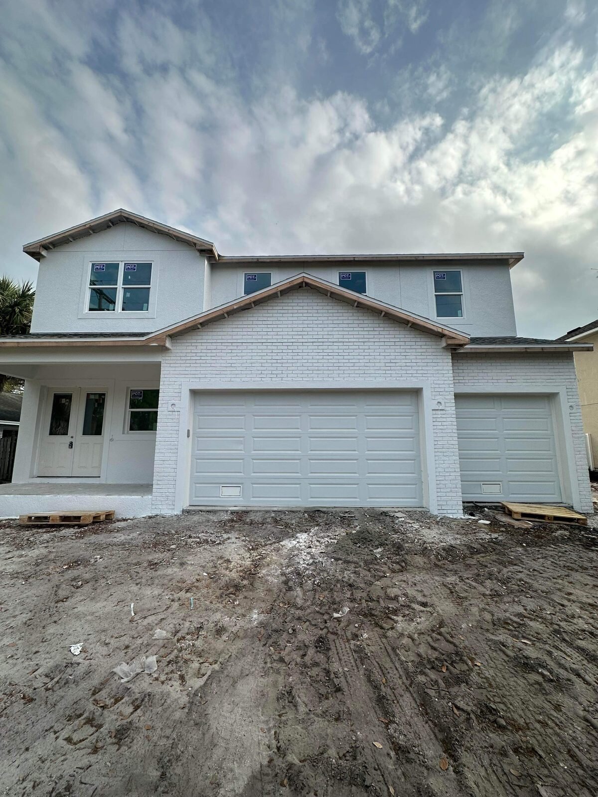 Newly built South Tampa house with a white brick gable