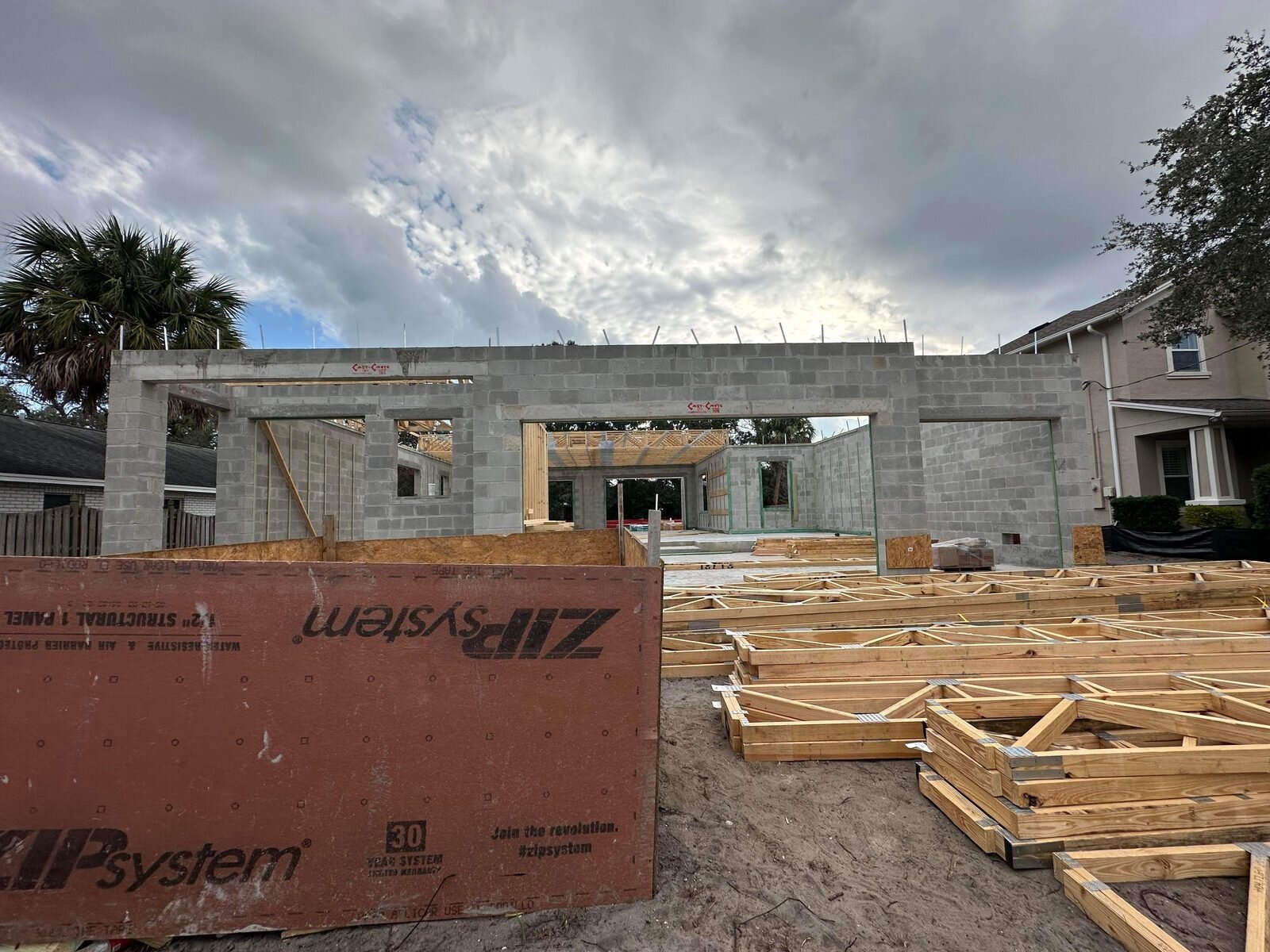 Block walls and roof framing on a new South Tampa house