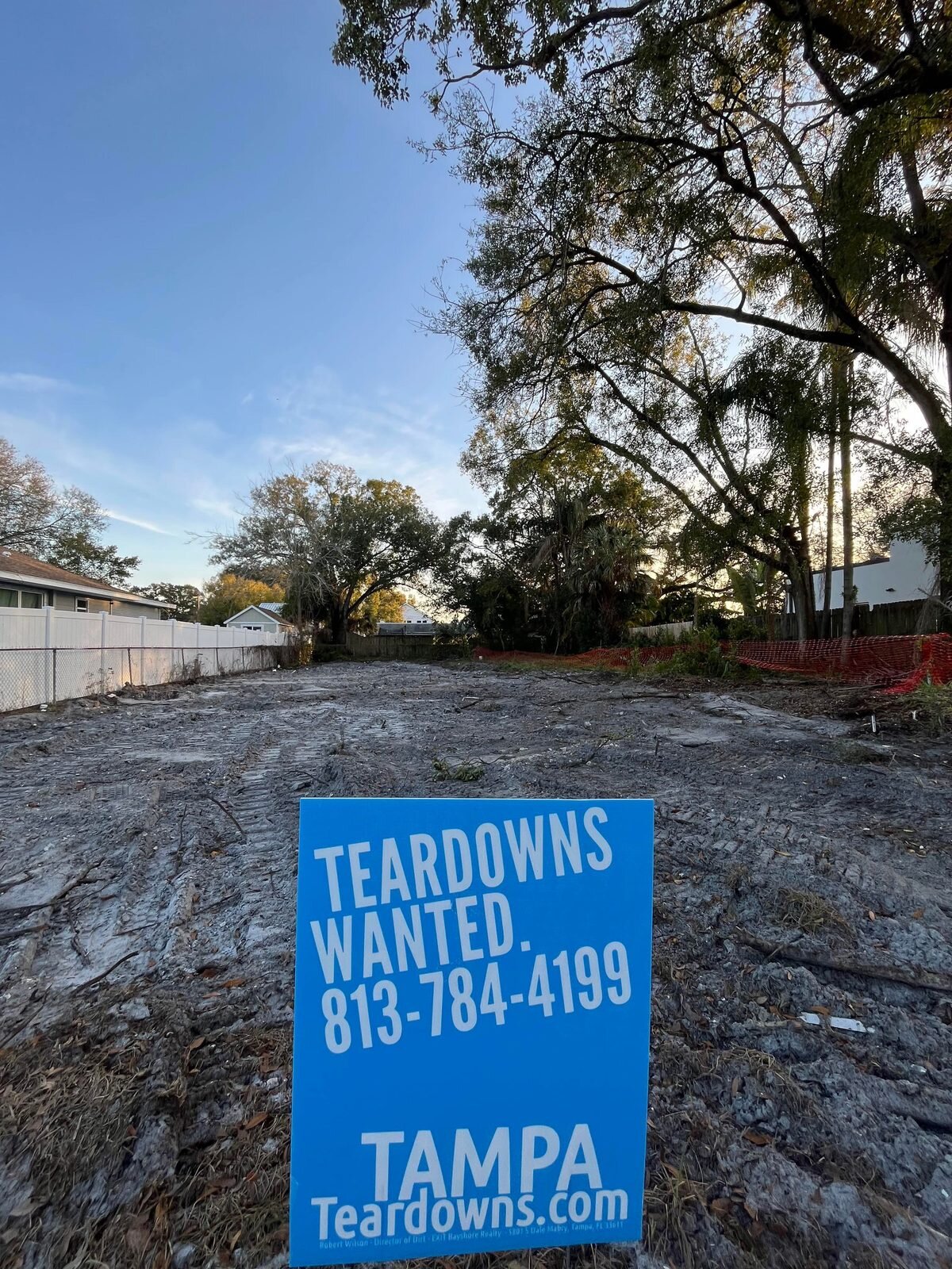 Freshly cleared South Tampa lot with a Teardowns Wanted sign at the street