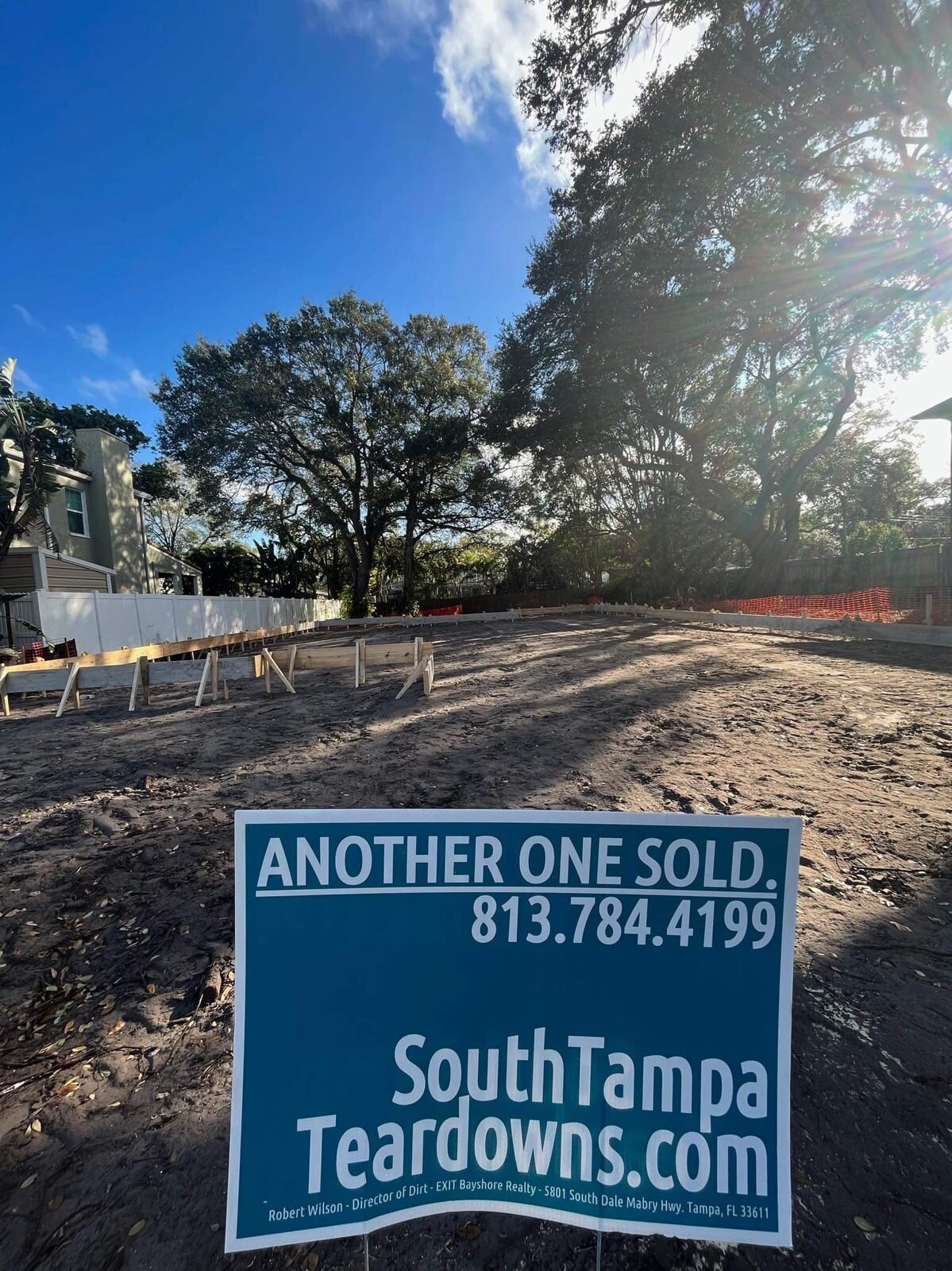 Wood forms set for a new foundation on a South Tampa lot with an Another One Sold sign