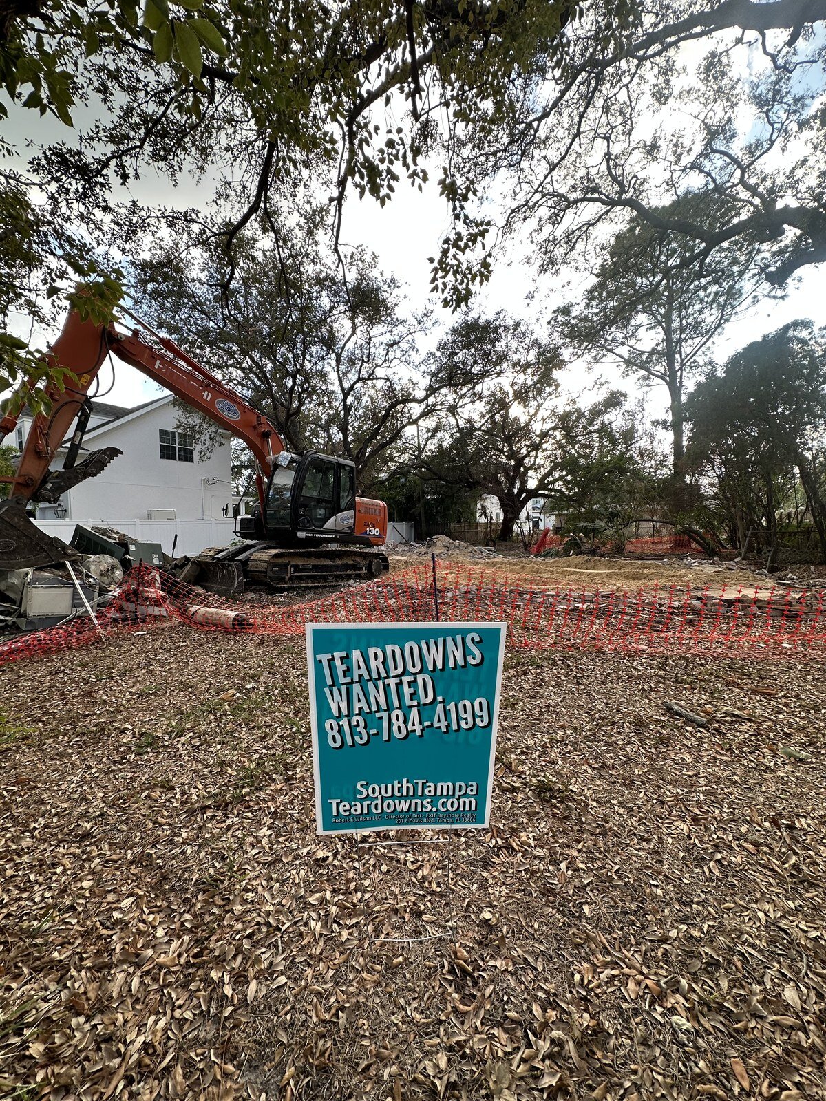 Excavator halfway through tearing down a South Tampa house