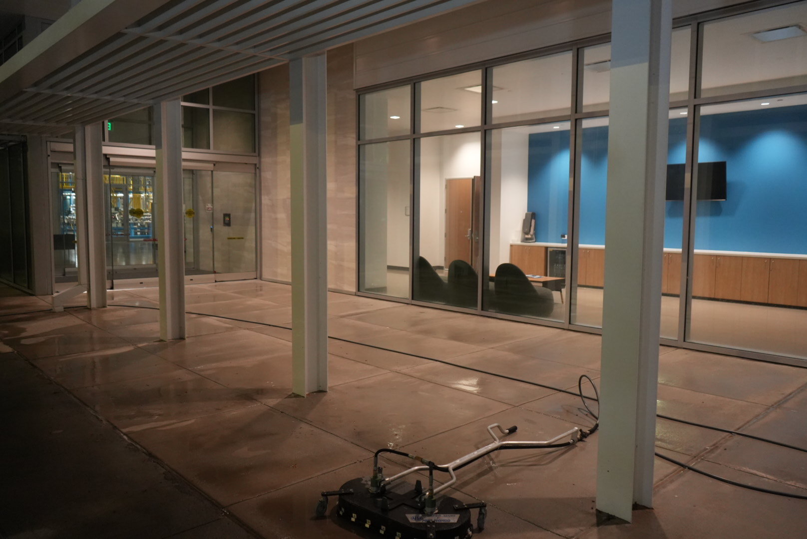 Clean storefront entry after commercial pressure washing in The Woodlands, TX